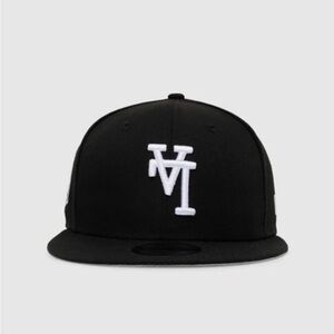 New Era Black Snapback Hat with White Embroidered Logo Upside Down